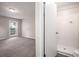 Bathroom featuring white tile shower, modern toilet and door to main bedroom at 3006 Alberta Dr, Marietta, GA 30062