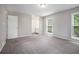 Bedroom featuring carpeted floors, gray paint and windows offering a bright view at 3006 Alberta Dr, Marietta, GA 30062