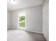 Bright bedroom with double closet for storage and a bright window overlooking the lawn at 3006 Alberta Dr, Marietta, GA 30062