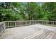Spacious backyard deck with wooden flooring, offering ample space for outdoor dining and relaxation at 3006 Alberta Dr, Marietta, GA 30062