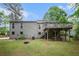 Large backyard with a well-maintained lawn, a deck and a fire pit area perfect for gatherings at 3006 Alberta Dr, Marietta, GA 30062