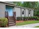 Inviting front entry featuring a light-blue door, stairs, and manicured bushes at 3006 Alberta Dr, Marietta, GA 30062