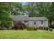 Single-story house with a light-blue front door and a green lawn surrounded by mature trees at 3006 Alberta Dr, Marietta, GA 30062