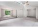 Spacious living area with vaulted ceiling, fan, and sliding door to the outside at 3006 Alberta Dr, Marietta, GA 30062