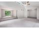 Spacious living room with steps, slider door to deck, and ceiling fan at 3006 Alberta Dr, Marietta, GA 30062