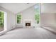 Bright living room with high ceilings, a fireplace, and large windows at 3006 Alberta Dr, Marietta, GA 30062