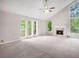 Spacious living room featuring a fireplace, high ceilings, and an abundance of natural light at 3006 Alberta Dr, Marietta, GA 30062
