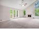 Bright living room with large windows, vaulted ceiling, carpet, and fireplace at 3006 Alberta Dr, Marietta, GA 30062
