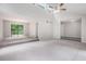 Open living area with high ceilings, a ceiling fan, and sliding glass doors to the backyard at 3006 Alberta Dr, Marietta, GA 30062