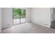 Light-filled living room with sliding glass door leading to the backyard deck at 3006 Alberta Dr, Marietta, GA 30062