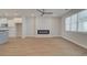 Open-concept living room with recessed lighting, modern fireplace, and connection to kitchen, great for entertaining at 3338 Cranston Ln, Kennesaw, GA 30144