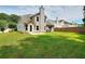 Large backyard with a well-manicured lawn and a patio perfect for outdoor entertaining at 4041 Ash Tree St, Snellville, GA 30039