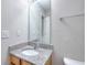 Neutral powder room features a granite countertop, undermount sink, and chrome faucet at 4041 Ash Tree St, Snellville, GA 30039