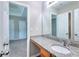 Bathroom vanity showcasing granite countertop, wood cabinets, and large mirror at 4041 Ash Tree St, Snellville, GA 30039