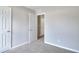 A standard-sized bedroom with carpet, light-colored walls, and a view to other rooms at 4041 Ash Tree St, Snellville, GA 30039