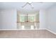 Spacious bedroom showcasing neutral paint, plush carpet, and an open view at 4041 Ash Tree St, Snellville, GA 30039