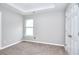 Bedroom featuring plush carpet, natural light, and a double door closet at 4041 Ash Tree St, Snellville, GA 30039