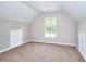 Cozy bedroom featuring neutral paint, plush carpet and a bright window with natural light at 4041 Ash Tree St, Snellville, GA 30039