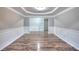 Large dining room featuring stylish wood floors, paneled walls, crown molding and sliding glass doors at 4041 Ash Tree St, Snellville, GA 30039