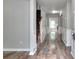 Inviting foyer features hardwood floors, neutral paint and molding leading into the home's living spaces at 4041 Ash Tree St, Snellville, GA 30039