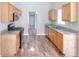 Well-lit kitchen with light wood cabinets, granite countertops and stainless steel appliances at 4041 Ash Tree St, Snellville, GA 30039