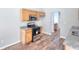 Open kitchen showcases a stainless steel range, granite counters and light wood cabinets at 4041 Ash Tree St, Snellville, GA 30039