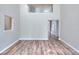 Bright living room boasts soaring ceilings, wood floors, and lots of natural light at 4041 Ash Tree St, Snellville, GA 30039