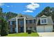 Beautiful two-story brick home with well-manicured lawn and attached two-car garage at 681 Burtons Cv, Hampton, GA 30228