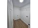 Laundry room with laminate floors and washer/dryer hookups at 681 Burtons Cv, Hampton, GA 30228