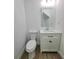 Stylish half-bath with modern vanity and mirror at 681 Burtons Cv, Hampton, GA 30228