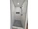 Beautifully tiled glass shower featuring a mosaic accent niche and floor at 681 Burtons Cv, Hampton, GA 30228
