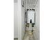 Utility room featuring a modern tankless hot water heater at 681 Burtons Cv, Hampton, GA 30228