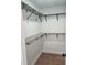 Walk-in closet with custom shelving and hardware at 681 Burtons Cv, Hampton, GA 30228