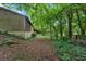 Secluded backyard surrounded by mature trees at 124 Chaseland Rd, Atlanta, GA 30328