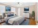 Stylish bedroom featuring hardwood floors, blue accent pillows, and plantation shutters at 124 Chaseland Rd, Atlanta, GA 30328