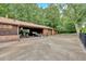 Large carport with parking, and three car garage attached to the home at 124 Chaseland Rd, Atlanta, GA 30328