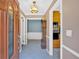 Inviting foyer with a decorative door, traditional grandfather clock, and views into adjacent rooms at 124 Chaseland Rd, Atlanta, GA 30328