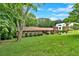 Charming single-story home with a well-manicured front lawn and lush landscaping at 124 Chaseland Rd, Atlanta, GA 30328
