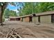 Long driveway leading to four garage doors and additional parking at 124 Chaseland Rd, Atlanta, GA 30328