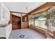 Sunlit kitchen area features wood beams, breakfast nook, and backyard views, merging charm with functionality at 124 Chaseland Rd, Atlanta, GA 30328