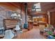 Eclectic living room with wood and brick elements, skylight, piano, and vintage decor at 124 Chaseland Rd, Atlanta, GA 30328