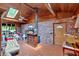 Cozy sunroom featuring brick walls, wood-paneled ceiling, skylight, brick floors, and a ceiling fan at 124 Chaseland Rd, Atlanta, GA 30328