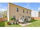 Large fenced backyard with patio, egg chair, mature trees and manicured lawn at 145 Silver Mine Trl, Austell, GA 30168
