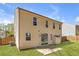 Backyard featuring a sliding glass door, a small storage shed, and green grass at 145 Silver Mine Trl, Austell, GA 30168