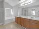 Bathroom with a double vanity, garden tub, and separate shower at 145 Silver Mine Trl, Austell, GA 30168