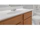Bathroom featuring a sink with wood cabinets, white countertop, toilet, and bathtub at 145 Silver Mine Trl, Austell, GA 30168