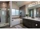 Modern bathroom featuring a walk-in shower, tub, and dual vanity at 145 Silver Mine Trl, Austell, GA 30168