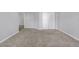A spacious carpeted bedroom features white walls and bi-fold closet doors at 145 Silver Mine Trl, Austell, GA 30168