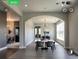 Bright dining room featuring modern light fixture, beautiful archway, and natural light from the large window at 145 Silver Mine Trl, Austell, GA 30168