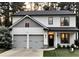 Beautifully designed home with gray siding, black-framed windows, and a spacious two-car garage at 145 Silver Mine Trl, Austell, GA 30168